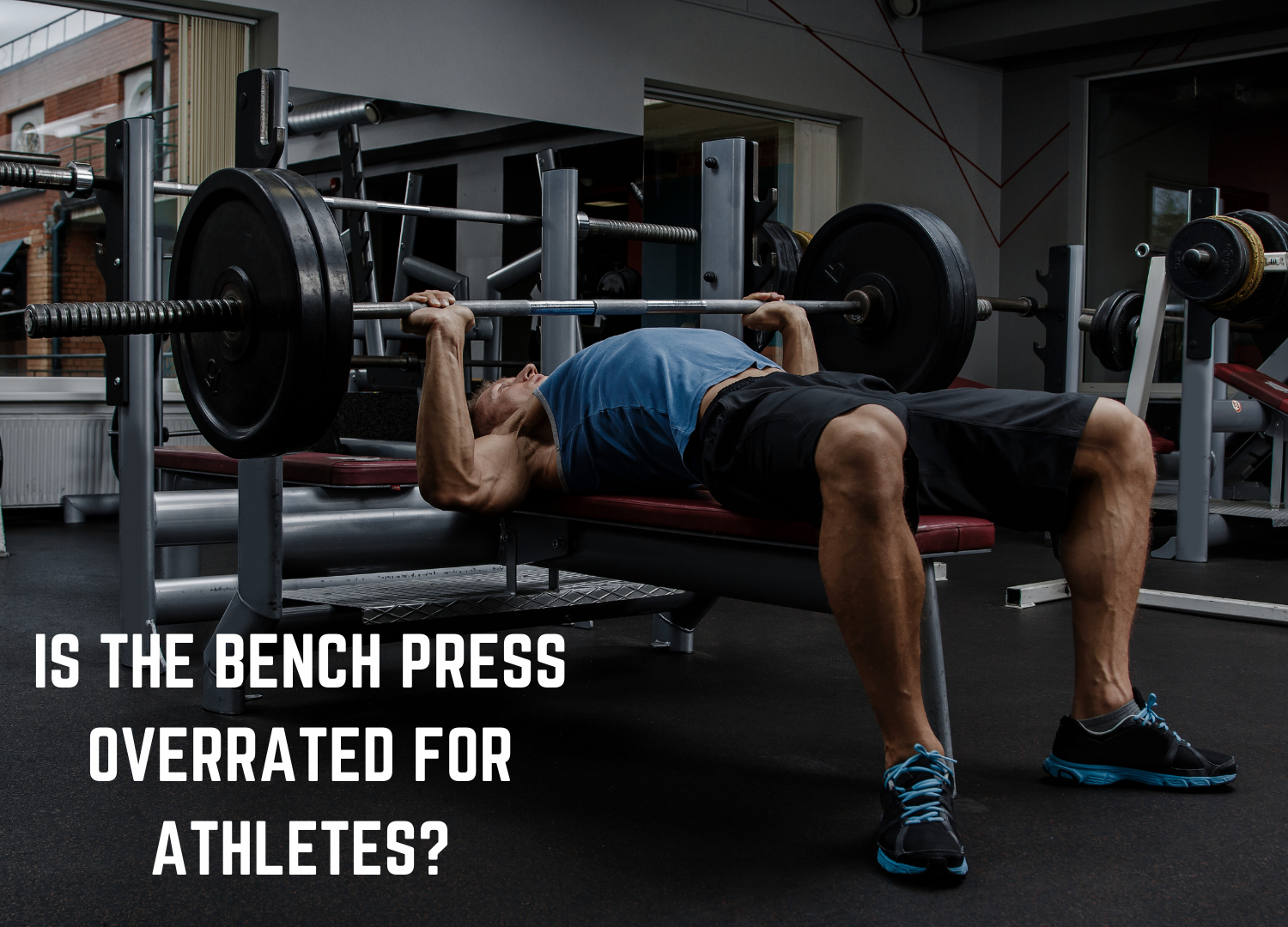 Athlete performing a flat barbell bench press